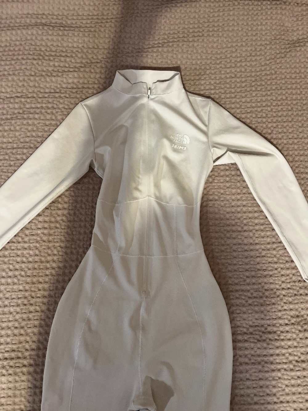 The North Face x Skims Refina full body suit